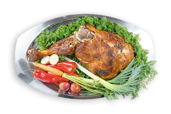 Телячья нога, выдержанная в маринаде из меда и хрена, запеченная с зернами горчицы